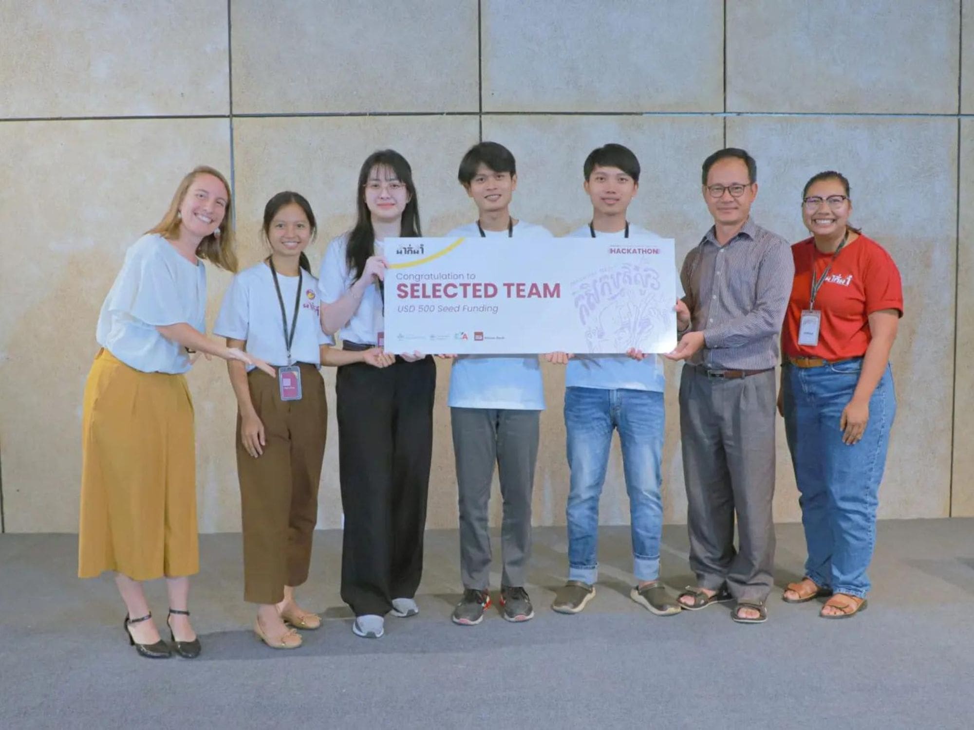 Members of the team Chiv-Cheat pose with their mentors at the end of the DakDam hackathon.