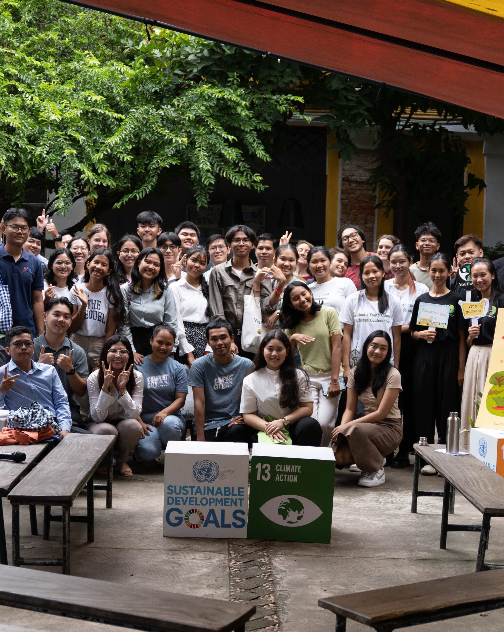 A large group of young Cambodians pose for a photo during Climate Action Week.