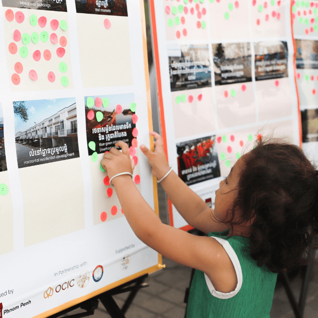 A little girl also participant in doing the dot-voting at Koh Norea about urban planning