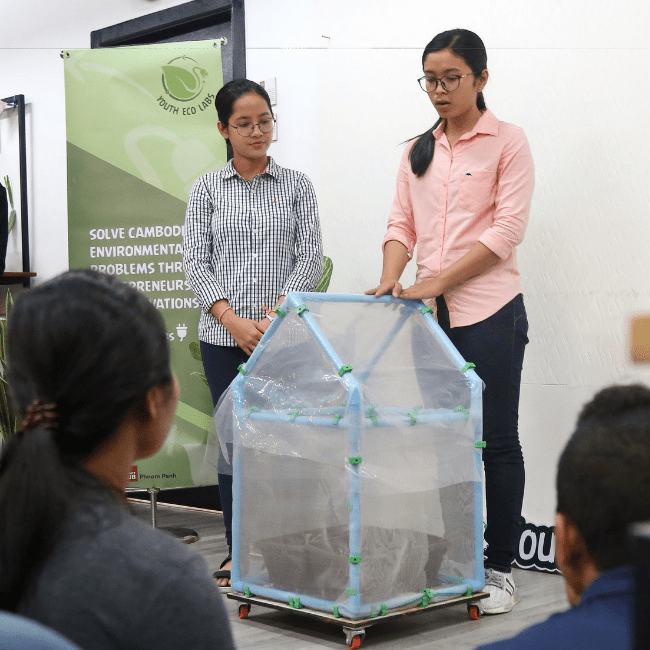 Two female presenting their ideas about environmental topic on Youth Eco Labs program in Cambodia