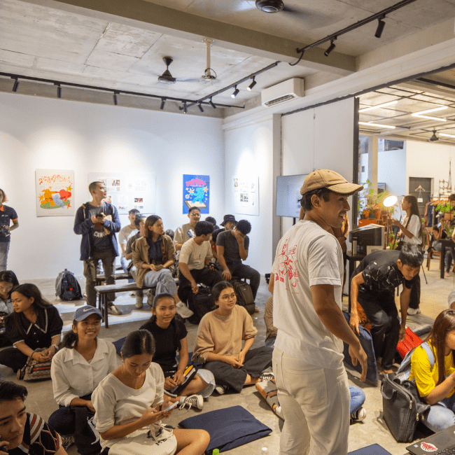 A large youth of participant in a big room waiting to watch the film screening at Friend Future Factory of Prosob Exhibition in Cambodia