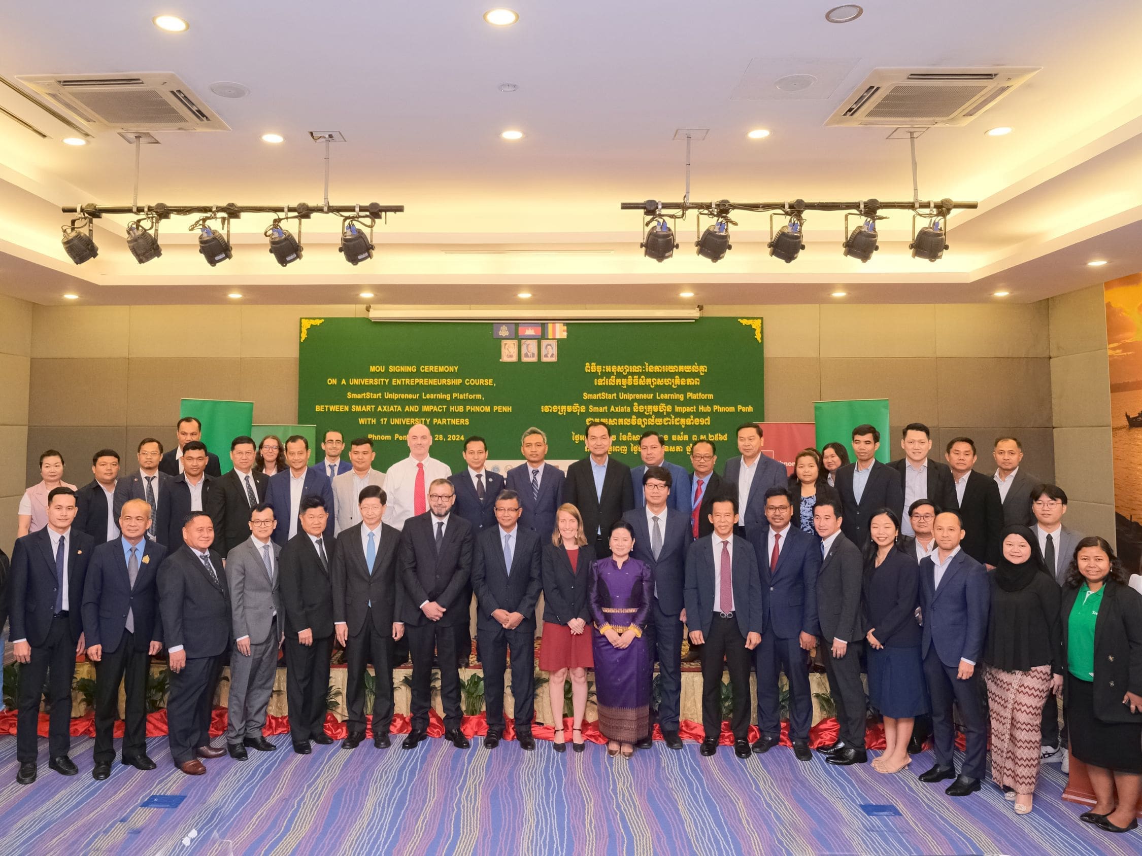 Representatives from 17 Cambodian universities, partners in the Unipreneur Learning Platform, with government representatives and representatives from Smart and Impact Hub Phnom Penh line up to take a group photo.