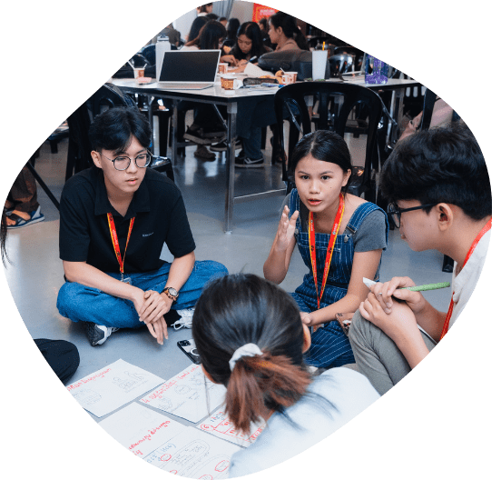 A small group of youth brainstorming idea and have a discussion at Changemaker2 Hackathon in Cambodia